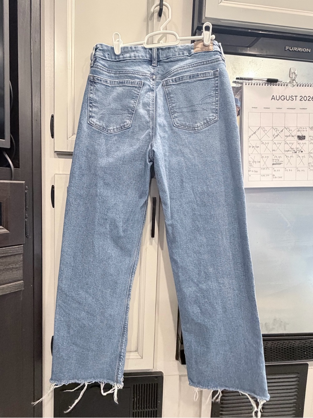 American Eagle Outfitters Light Blue Wide-Leg Jeans with Frayed Hem